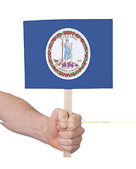 Image showing Hand holding small card - Flag of Virginia