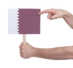 Image showing Hand holding small card - Flag of Qatar