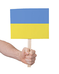 Image showing Hand holding small card - Flag of Ukraine