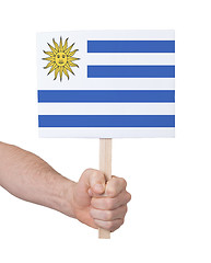 Image showing Hand holding small card - Flag of Uruguay