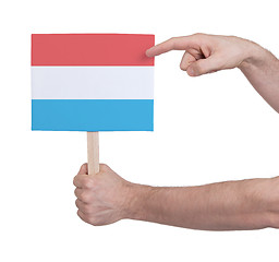 Image showing Hand holding small card - Flag of Luxembourg