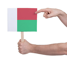 Image showing Hand holding small card - Flag of Madagascar