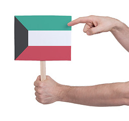 Image showing Hand holding small card - Flag of Kuwait