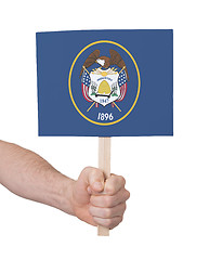 Image showing Hand holding small card - Flag of Utah