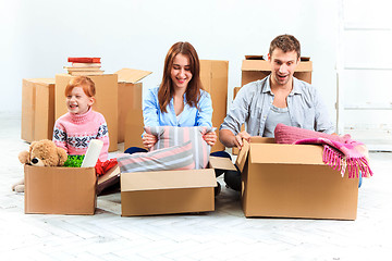 Image showing The happy family  at repair and relocation