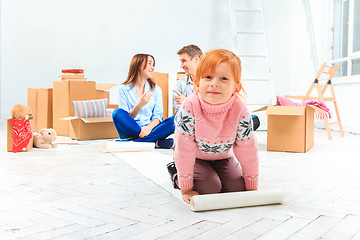 Image showing The happy family  at repair and relocation