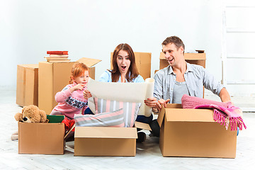 Image showing The happy family  during repair and relocation