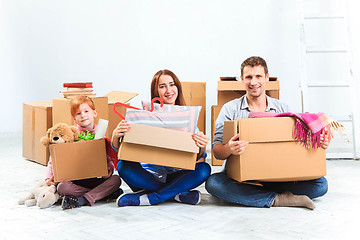 Image showing The happy family  at repair and relocation