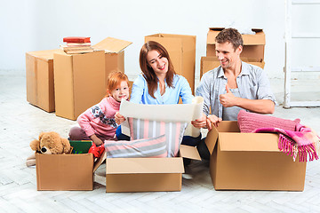 Image showing The happy family  during repair and relocation