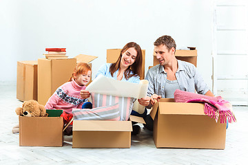 Image showing The happy family  during repair and relocation