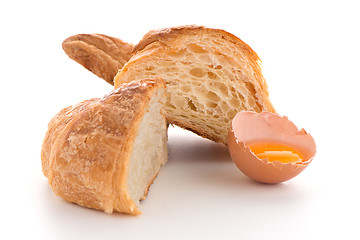 Image showing Croissant and raw egg