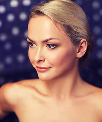 Image showing close up of young woman sitting in bath towel