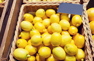 Image showing ripe lemons at food market