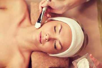 Image showing close up of young woman and cosmetologist in spa