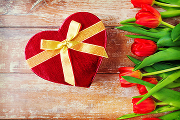 Image showing close up of red tulips and chocolate box