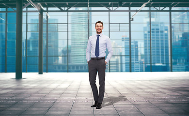 Image showing handsome businessman over city construction