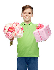 Image showing happy boy holding flower bunch and gift box