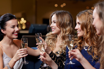 Image showing happy women with champagne glasses at night club