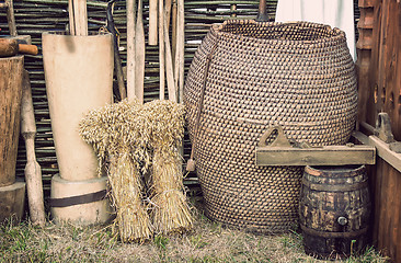 Image showing Two beams and ancient objects of rural life.