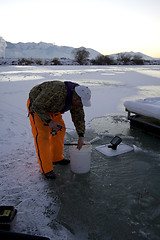 Image showing Fisherman Icefishing