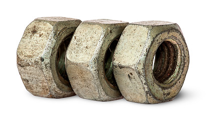 Image showing Three old rusty nuts in a row