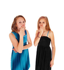 Image showing Two girls with hands over there mouth.