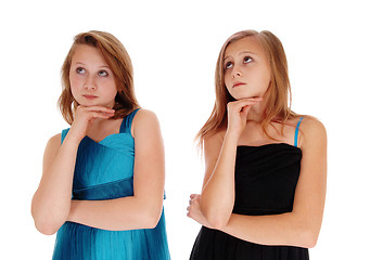 Image showing Two pretty girls thinking hard.