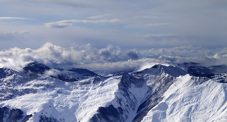 Image showing Panoramic view on winter mountains in clouds