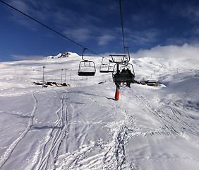 Image showing Chair-lift and off-piste slope in nice sun day