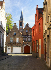 Image showing medieval buildings on cobblestone street  garage and cathedral i