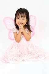 Image showing Chinese little girl wearing butterfly custome with praying gestu