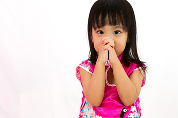 Image showing Chinese little girl wearing Cheongsam praying