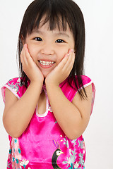 Image showing Chinese Little Girl wearing Cheongsam with greeting gesture