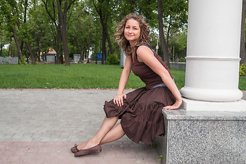 Image showing portrait of young beautiful woman in city park