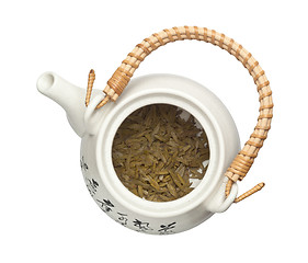 Image showing Teapot with chinese tea leaves