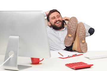 Image showing Portrait of businessman talking on mobile phone in office