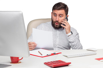 Image showing Portrait of businessman talking on mobile phone in office