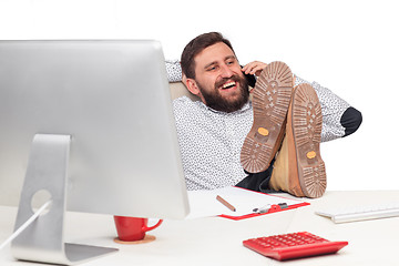 Image showing Portrait of businessman talking on mobile phone in office