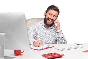 Image showing Portrait of businessman talking on mobile phone in office