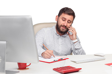Image showing Portrait of businessman talking on mobile phone in office