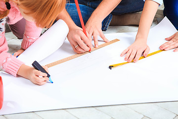 Image showing The happy family  at repair and relocation