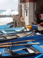 Image showing   fishing row boats on land during rough sea Rio Marriore Cinque