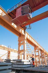 Image showing Slinger with crane operator work on loading