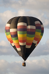 Image showing Hot-Air Balloon Floating Among Clouds