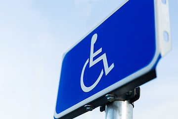 Image showing close up of road sign for disabled outdoors