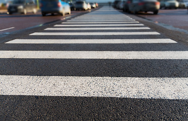 Image showing close up of pedestrian crosswalk on city parking