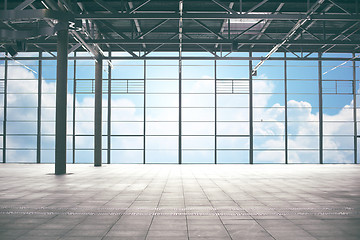 Image showing airport terminal room over blue sky and clouds