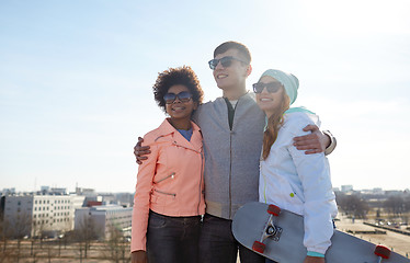 Image showing happy teenage friends in shades talking on street