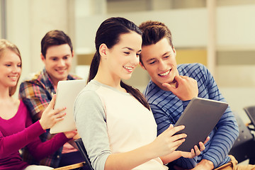 Image showing group of smiling students with tablet pc