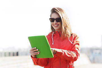 Image showing happy young woman or teenage girl with tablet pc